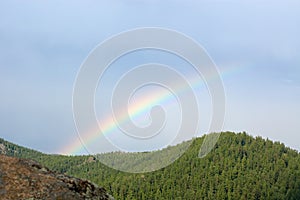 Rainbow over a taiga, Stolby park photo