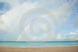 Rainbow over tropical beach