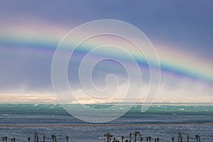 Rainbow over the turquoise waters of the Dead Sea