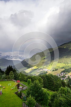 Rainbow over valley with Schattberg Mountain, Saalbach-Hinterglemm, Austria