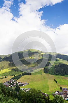 Rainbow over valley with Schattberg Mountain, Saalbach-Hinterglemm, Austria