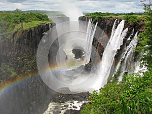 Rainbow over Victoria Falls on Zambezi River