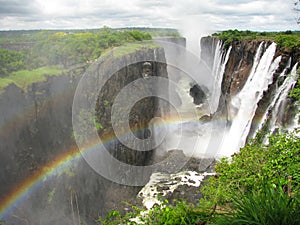 Rainbow over Victoria Falls on Zambezi River photo