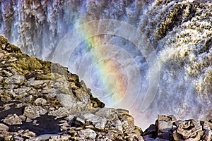 Rainbow over waterfall Dettifoss, northern Iceland.