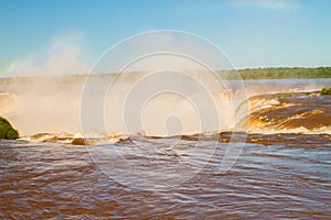 Rainbow over waterfall