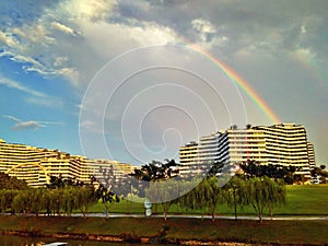 Rainbow over waterfront housing