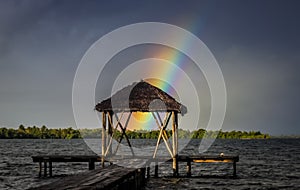 Rainbow over wooden pier