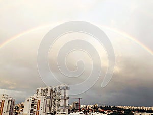 Rainbow panorama of Rishon Le Zion, clouds. Top view of Israeli city