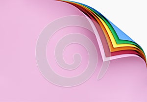 Rainbow paper pages with a curled corner. Multicolored folded pages