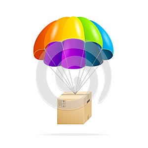 Rainbow parachute with cardboard box on a white