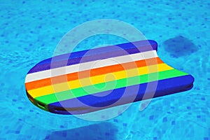 Rainbow pattern styrofoam swimming board baseboard floating in p