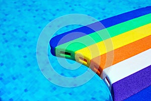 Rainbow pattern styrofoam swimming board baseboard floating in p