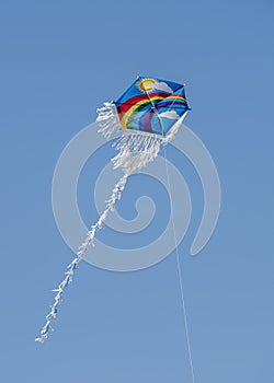 Rainbow Patterned Kite Flying In The Air