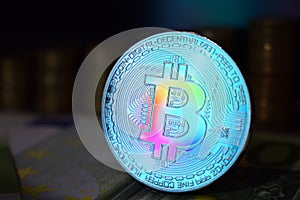 The rainbow physical bitcoin coin is BTC, preferably color blue.