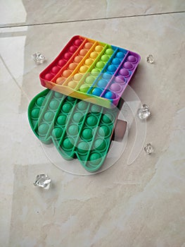 Rainbow Pop Fidget and Green Tree Pop Fidget