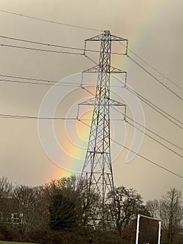 A rainbow and a pylon