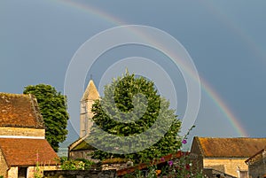 Rainbow after the rain over the church in TaizÃ©, France