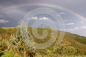 rainbow in a rainy and sunny day