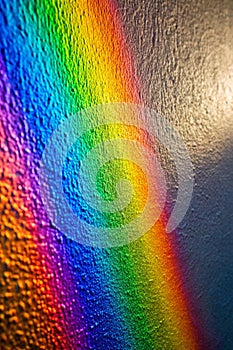 Rainbow reflective light on textured surface
