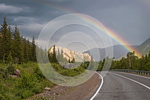 Rainbow road mountains clouds forest