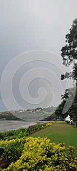 Rainbow, sea, beach and garden