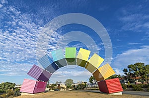 A rainbow of sea containers against a beautiful blue sky in Fremantle, Western Australia