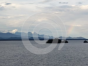 Rainbow, sea, sky and the mountain