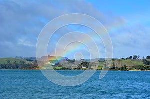 Rainbow in the sky and above the sea