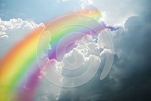 Rainbow on sky with clouds close up