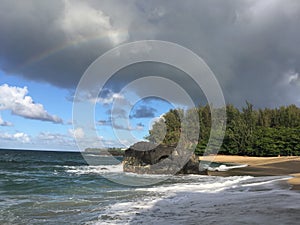 Rainbow in Sky Seen from Lumahai Beach on Kauai Island, Hawaii.