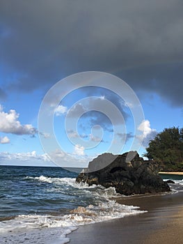 Rainbow in Sky Seen from Lumahai Beach on Kauai Island, Hawaii.