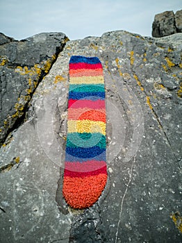 rainbow sock lost on the beach