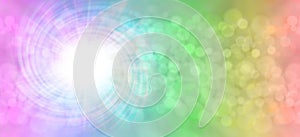 Rainbow spiral light burst bokeh background