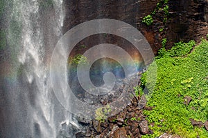 Rainbow on spray from waterfall