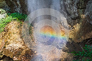 Rainbow spray in a waterfall