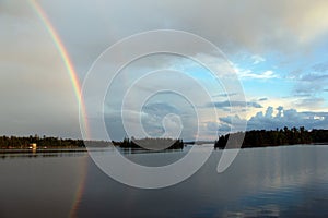 Rainbow over Stormbay, Lake of the Woods, Kenora, Ontario photo