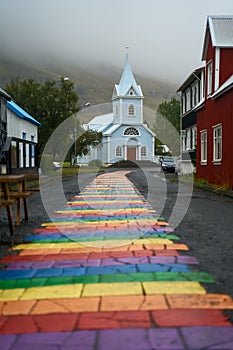 Rainbow street and Seydisfjardarkirkja church