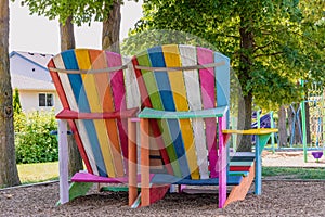 Rainbow striped oversized Adirondack chairs