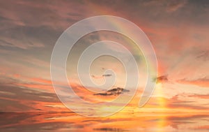 Rainbow sunset on blue sky fluffy white clouds summer   at sea  meadow green grass field nature background landscape