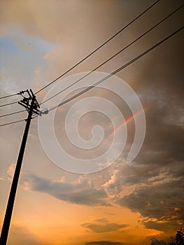 Rainbow and sunset after rain