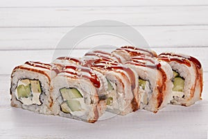 Rainbow Sushi Roll with salmon, eel, tuna, avocado, royal prawn, cream cheese Philadelphia, caviar, chukka. Sushi menu. Japanese f photo