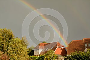 Rainbow in threatening skies during storm Brian in UK photo