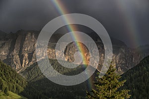 Rainbow after the thunderstorm at the sunset