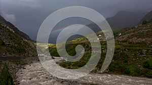 Rainbow Time lapse of flowing river and smoky mountains