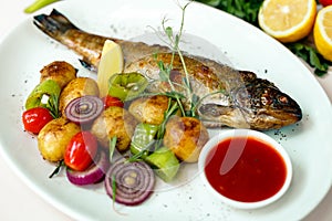 Rainbow trout with grilled vegetables and citrus sauce