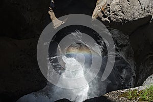 Rainbow on Trummelbach Falls - a series of ten glacier-waterfalls inside the mountain. Lauterbrunnen-Stechelberg valley