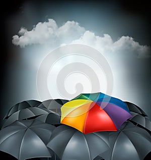 A rainbow umbrella amongst grey ones. Uniqueness concept.