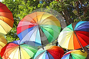 Rainbow umbrellas hanging from the ceiling