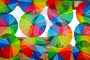 Rainbow umbrellas roof street in Victory Passage , Bucharest