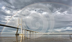 Rainbow on the Vasco de Gama Bridge, Lisbon, Portugal photo
